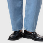 JONES + CO Jazzie barrel jeans in light blue denim worn with black leather loafers