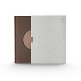 JONES + CO Open Journal with a brown fabric cover and a grey slipcase featuring a circular cutout design.