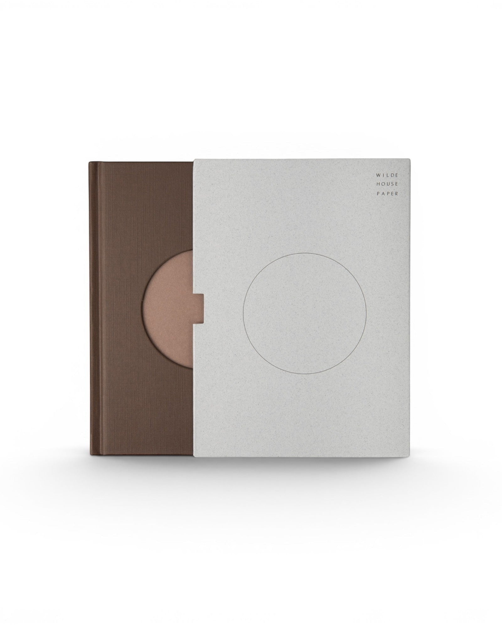JONES + CO Open Journal with a brown fabric cover and a grey slipcase featuring a circular cutout design.