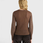 JONES + CO Loa ribbed lurex turtleneck top in caramello brown with long amphora sleeves, back view on a model.
