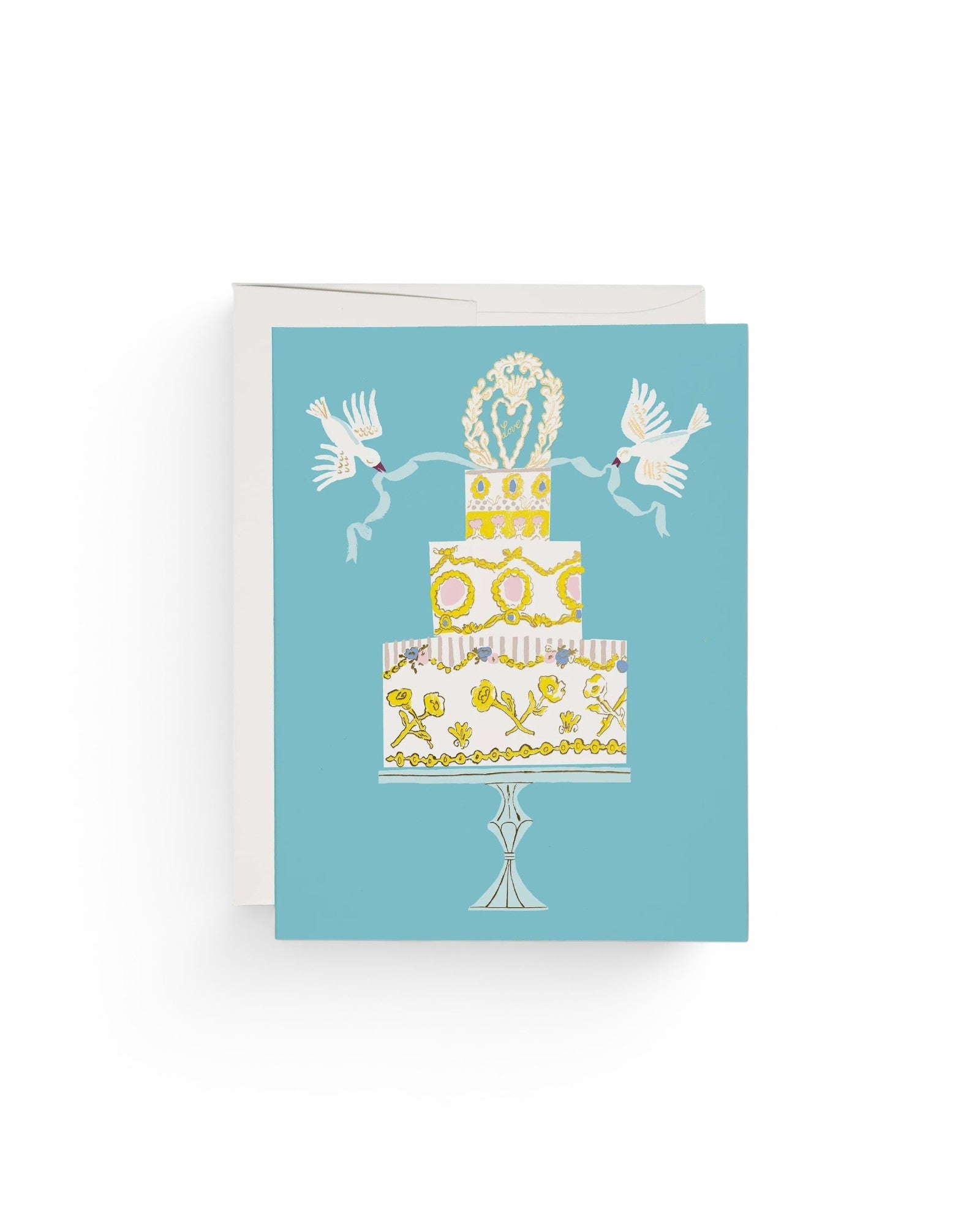 JONES + CO Love Cake wedding greeting card featuring a tiered cake illustration with doves on a blue background