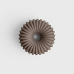 JONES + CO lülala soap bar in a circular, fluted design with a soft mauve rose clay hue.