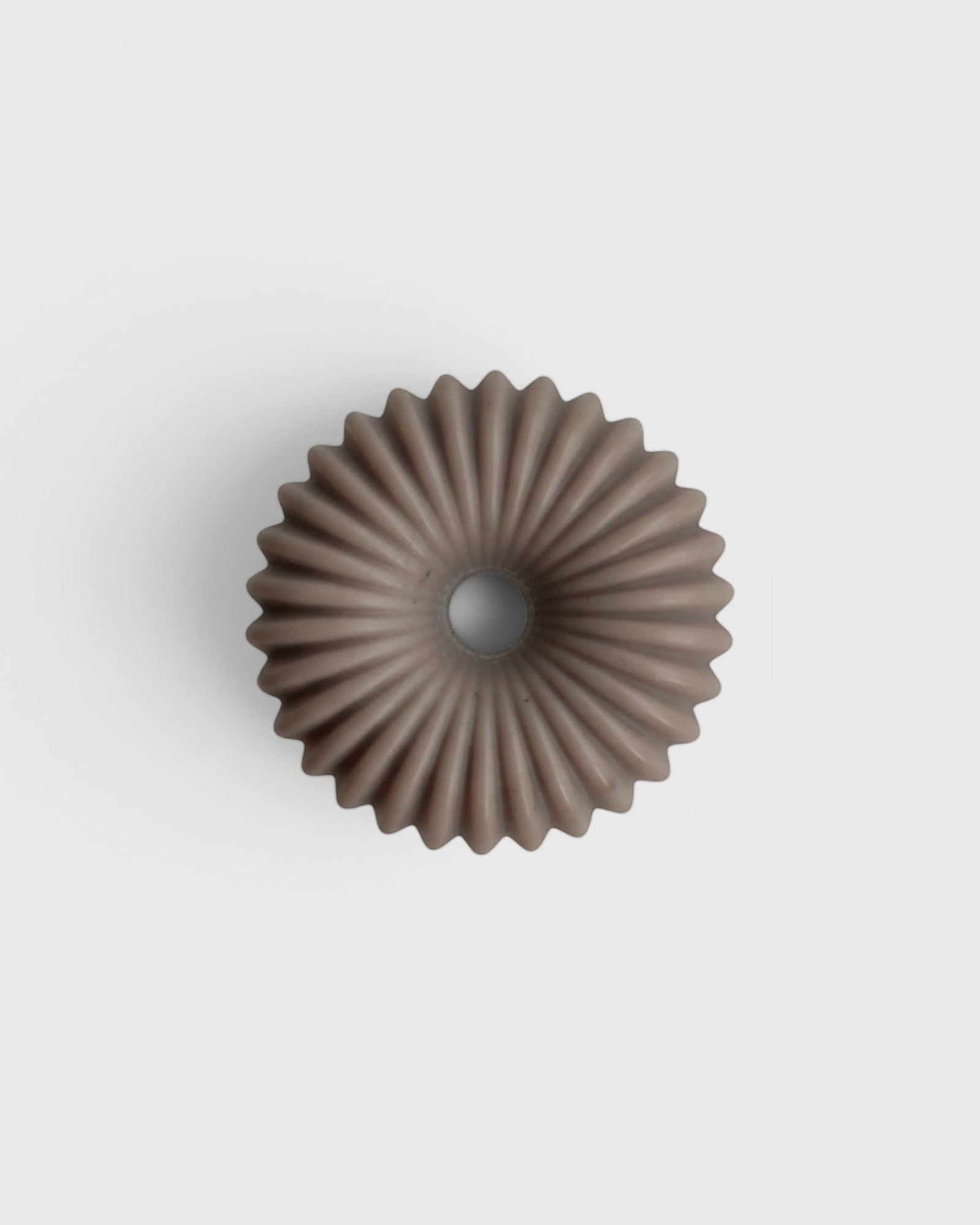 JONES + CO lülala soap bar in a circular, fluted design with a soft mauve rose clay hue.