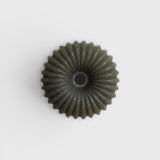 JONES + CO lülala lavender and pink grapefruit soap bar with a unique circular, ribbed, and textured green design.