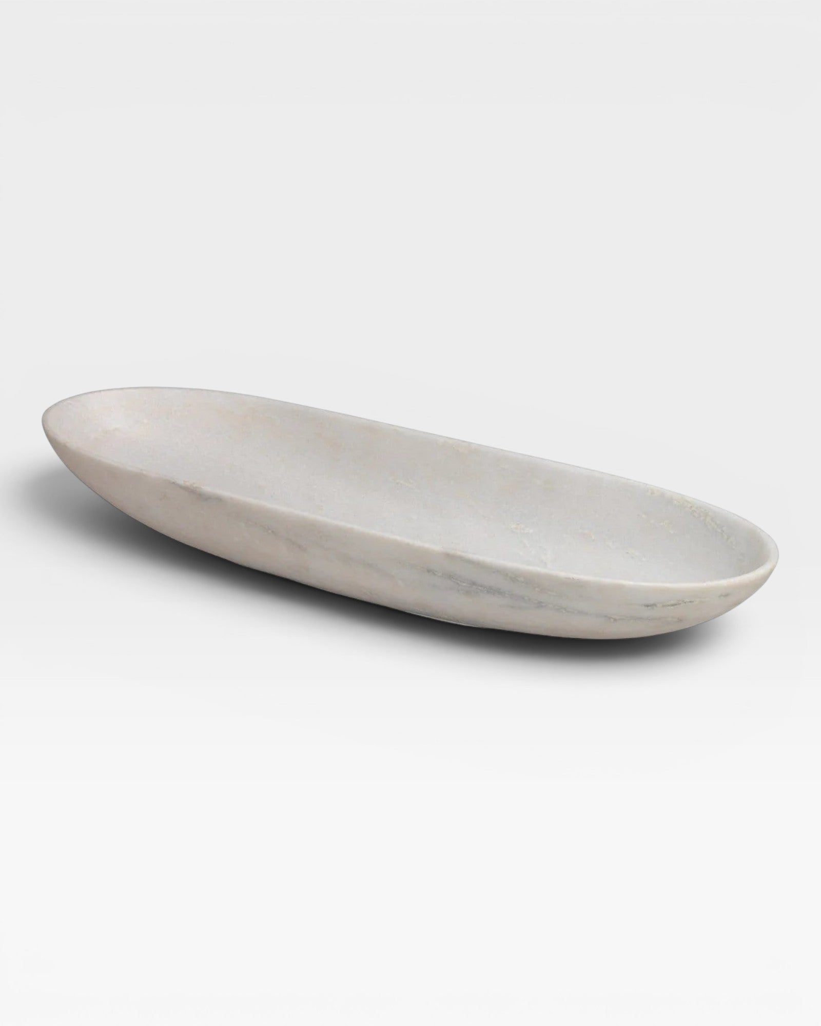 JONES + CO long oval bowl crafted from natural white marble with a smooth honed finish and unique grey veining.