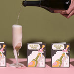 JONES + CO Mazel Tov greeting card featuring a champagne bottle illustration on heavyweight recycled paper