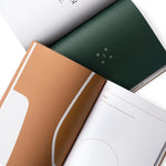 JONES + CO Me-est Me Journal open to pages with organic shapes, calming earth tones, and guided self-reflection prompts.