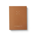 JONES + CO Me-est Me Journal with a tan cover and minimalist white typography for self-reflection exercises.