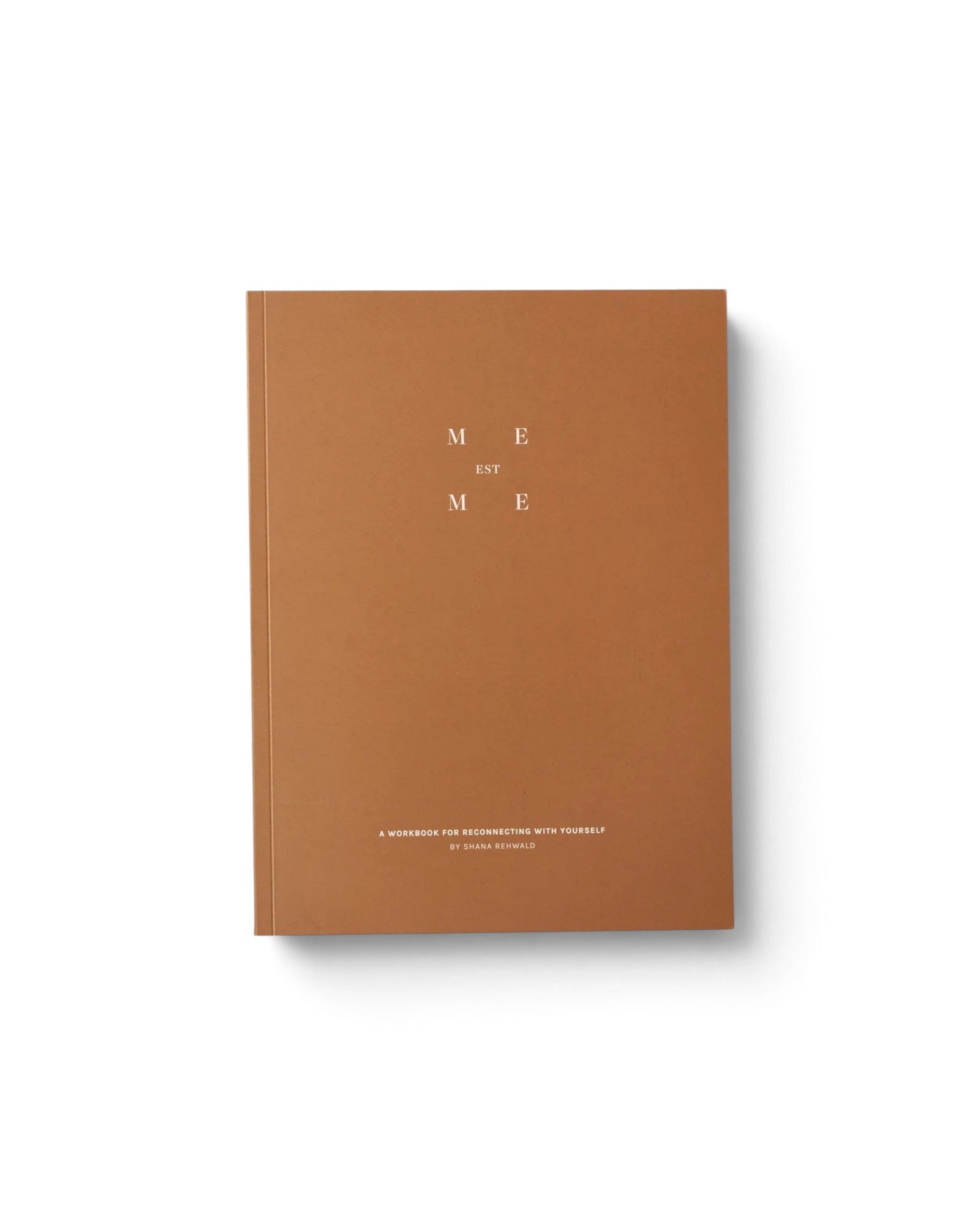 JONES + CO Me-est Me Journal with a tan cover and minimalist white typography for self-reflection exercises.