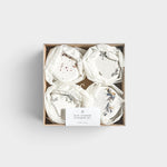 JONES + CO mini shower steamer set featuring four assorted aromatherapy tablets with dried floral botanicals in a box