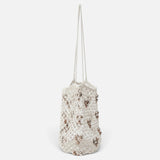 JONES + CO Mini Web Bag in silver featuring intricate macrame leather weaving and decorative bamboo beads.