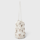 JONES + CO Mini Web Bag in silver featuring intricate macrame leather weaving and decorative bamboo beads.