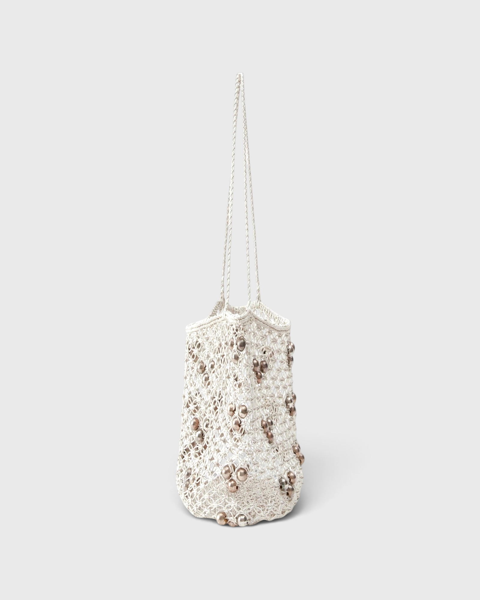 JONES + CO Mini Web Bag in silver featuring intricate macrame leather weaving and decorative bamboo beads.