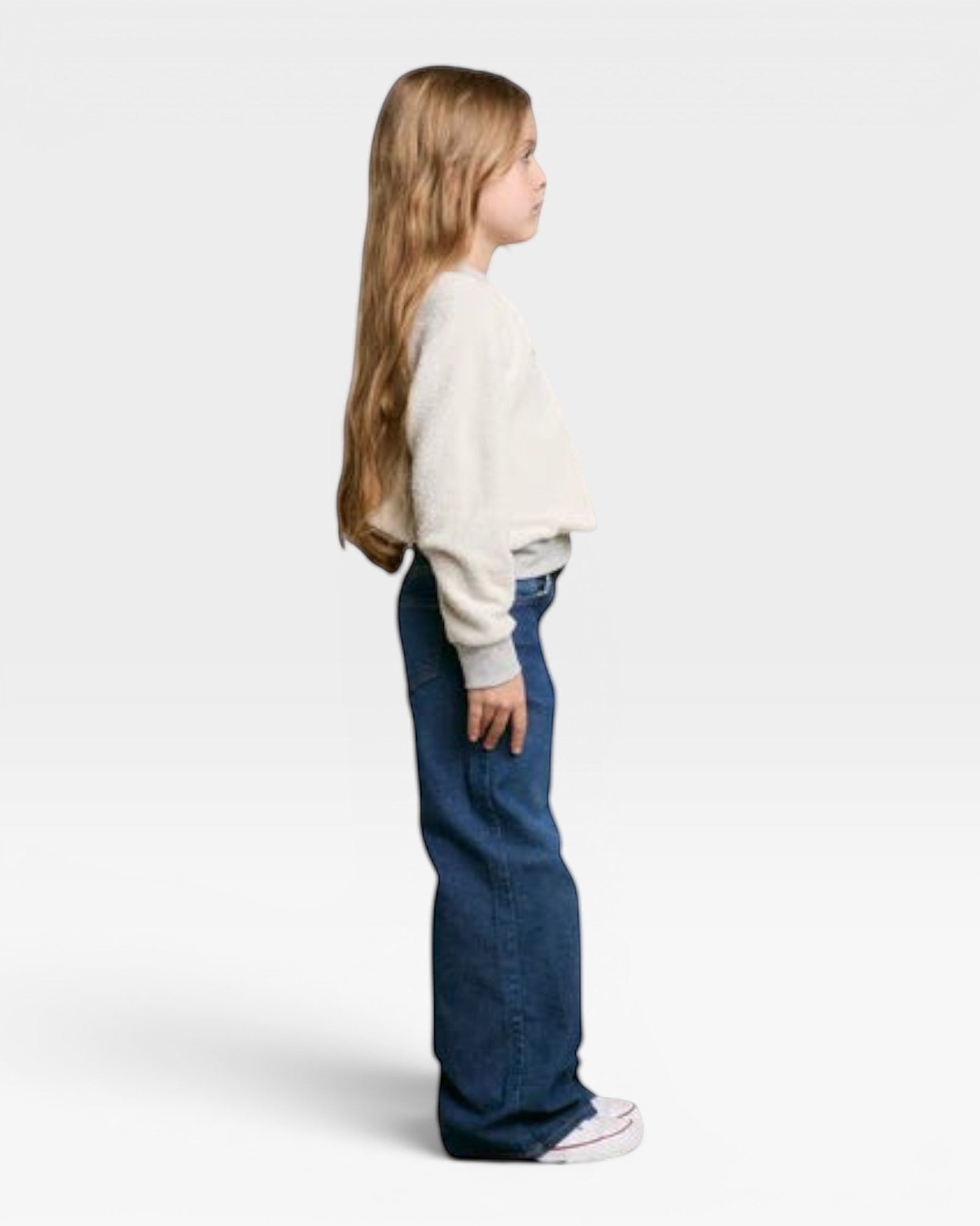 JONES + CO Mini Ziggy sweatshirt in heather grey soft cotton fleece worn by a young girl in profile view
