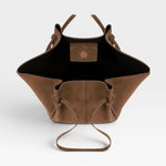 JONES + CO Mochi tote bag in cognac Italian suede with organic curves, knotted details, and an open top view.