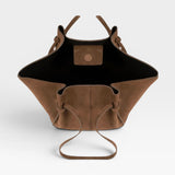 JONES + CO Mochi tote bag in cognac Italian suede with organic curves, knotted details, and an open top view.