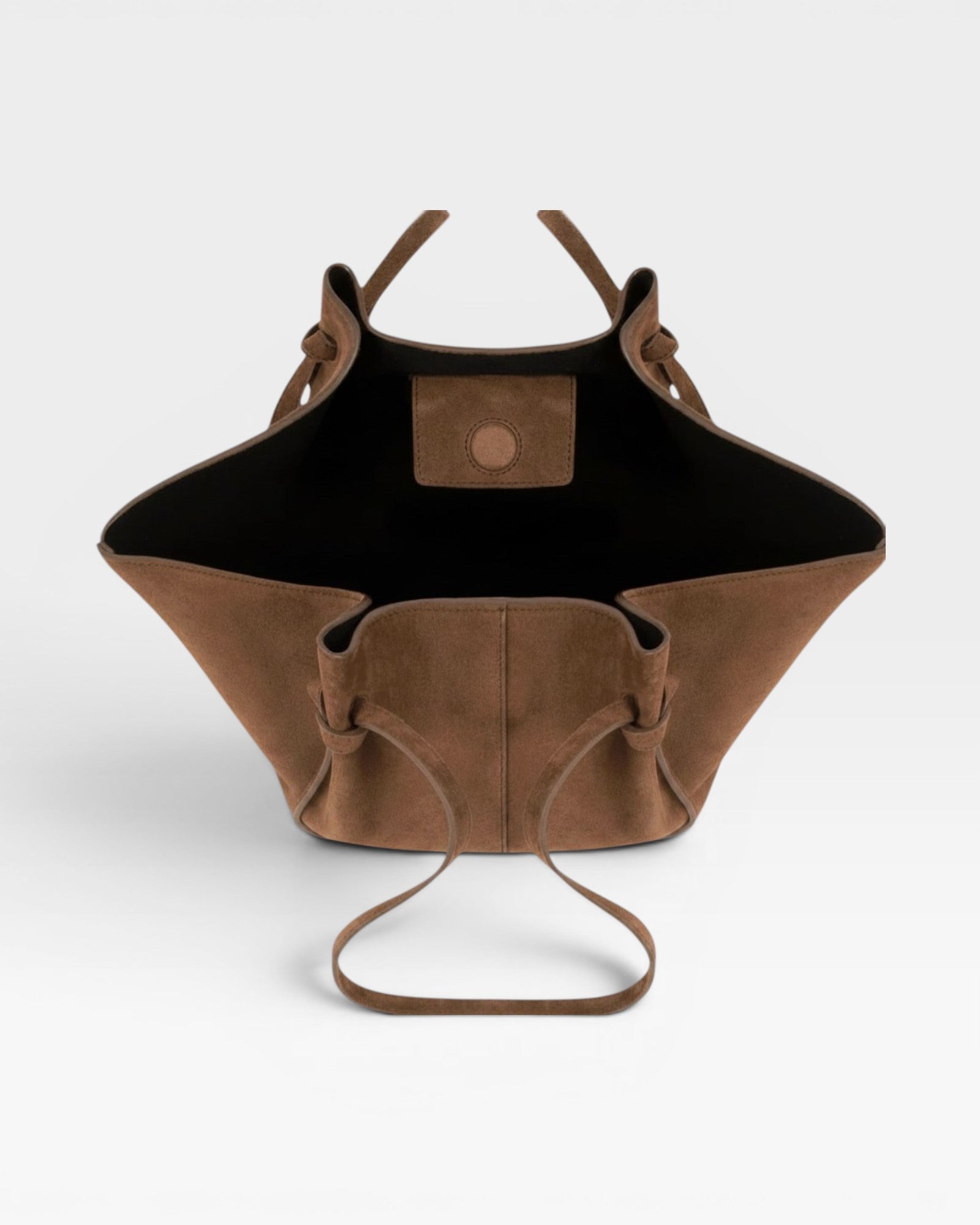 JONES + CO Mochi tote bag in cognac Italian suede with organic curves, knotted details, and an open top view.