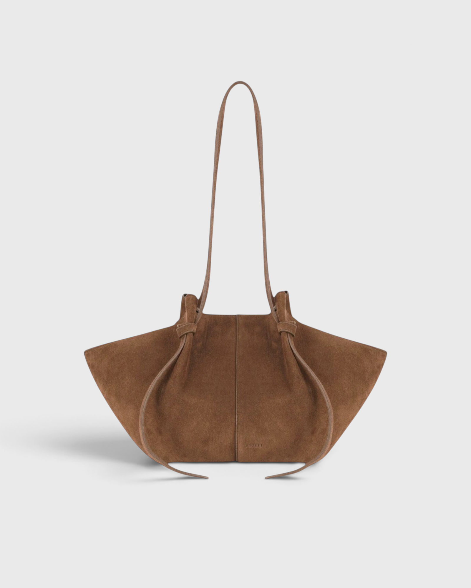 JONES + CO Mochi tote bag in cognac Italian suede featuring organic curves, knotted details, and a long shoulder strap.