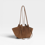 JONES + CO Mochi tote bag in cognac Italian suede featuring organic curves, folds, and knotted shoulder straps.