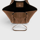 JONES + CO Mochi tote bag in cognac Italian suede with organic curves, knotted details, and an open top view.