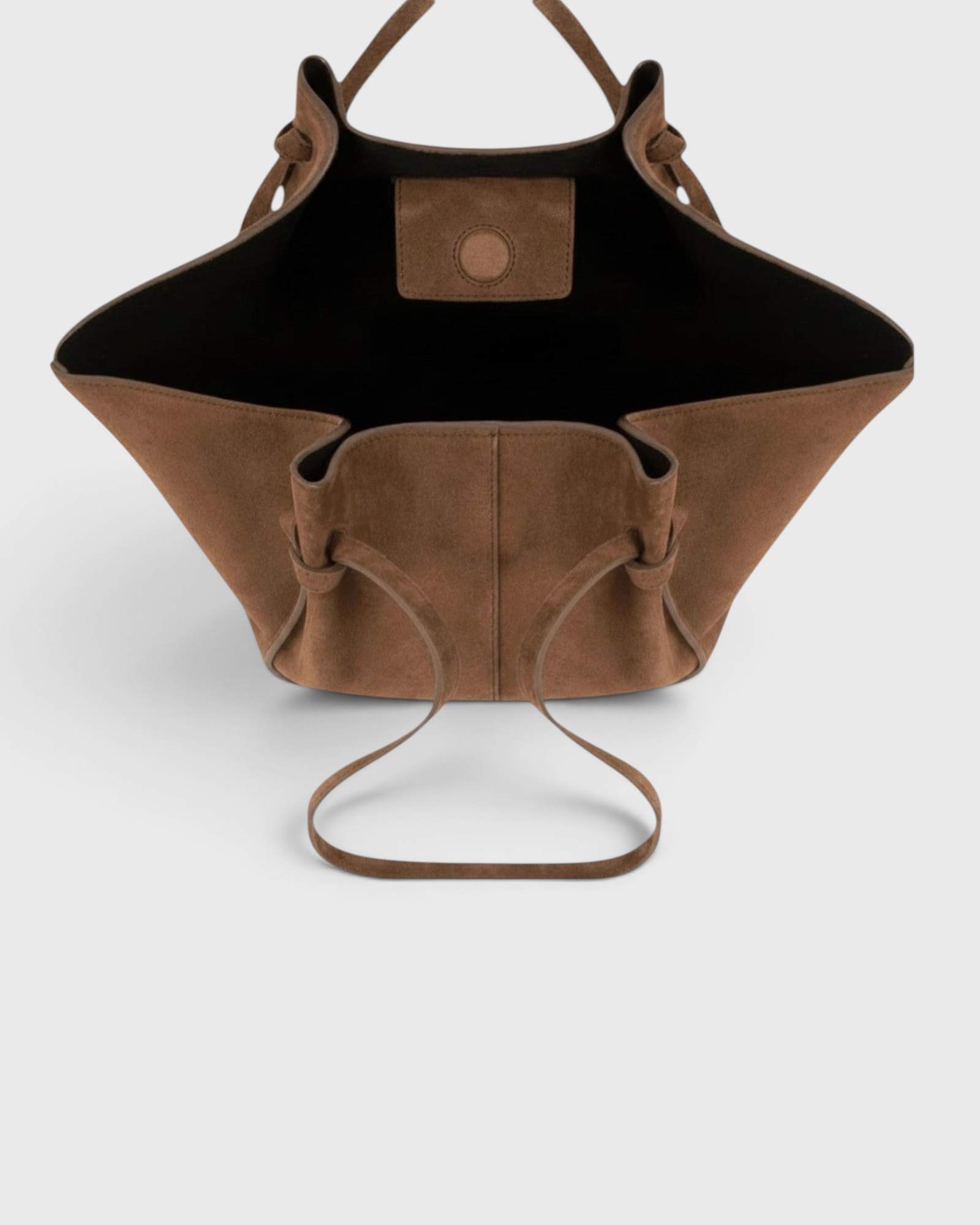 JONES + CO Mochi tote bag in cognac Italian suede with organic curves, knotted details, and an open top view.