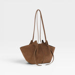 JONES + CO Mochi tote bag in cognac Italian suede featuring organic curves, folds, and knotted shoulder straps.