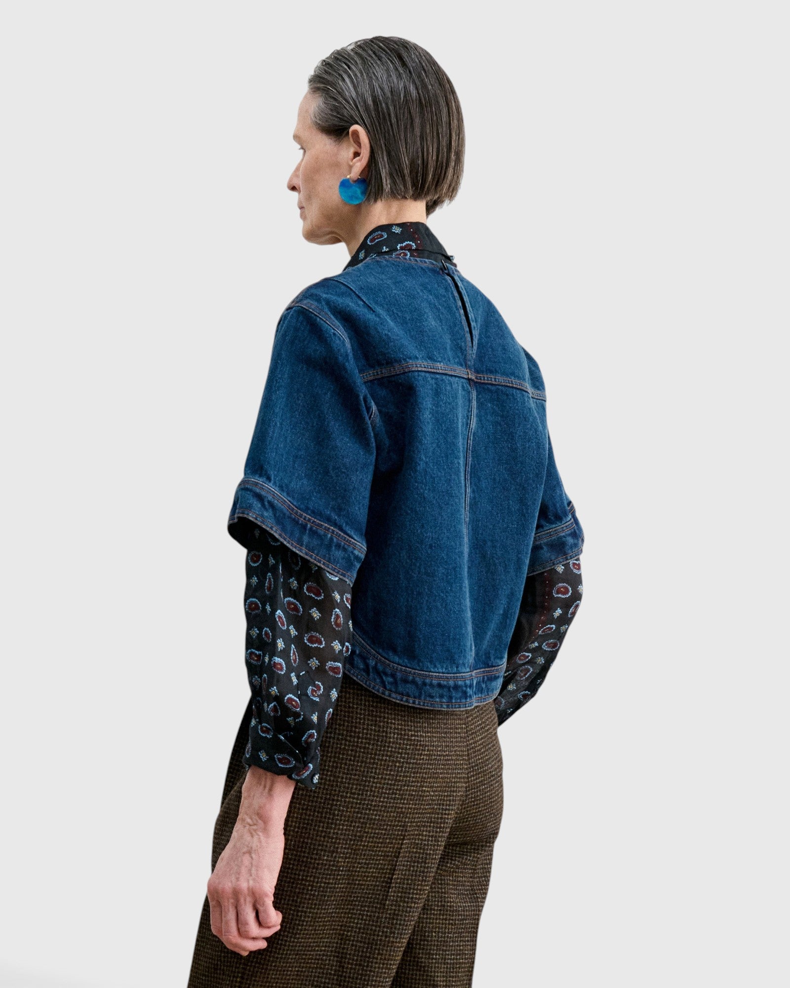 JONES + CO Fort Top in muddy indigo denim with a boxy silhouette, short sleeves, and back keyhole detail.