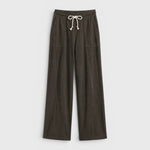 JONES + CO Noa straight-leg French terry pants in dark olive with a rope drawstring waist and deep side pockets.