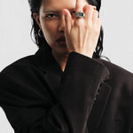 JONES + CO Nocturne Time Ring in silver with a smoke-colored crystal worn on a model in a black blazer.