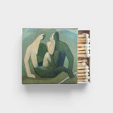 JONES + CO Nue matchbox featuring artistic green and cream abstract figures with wooden matches inside