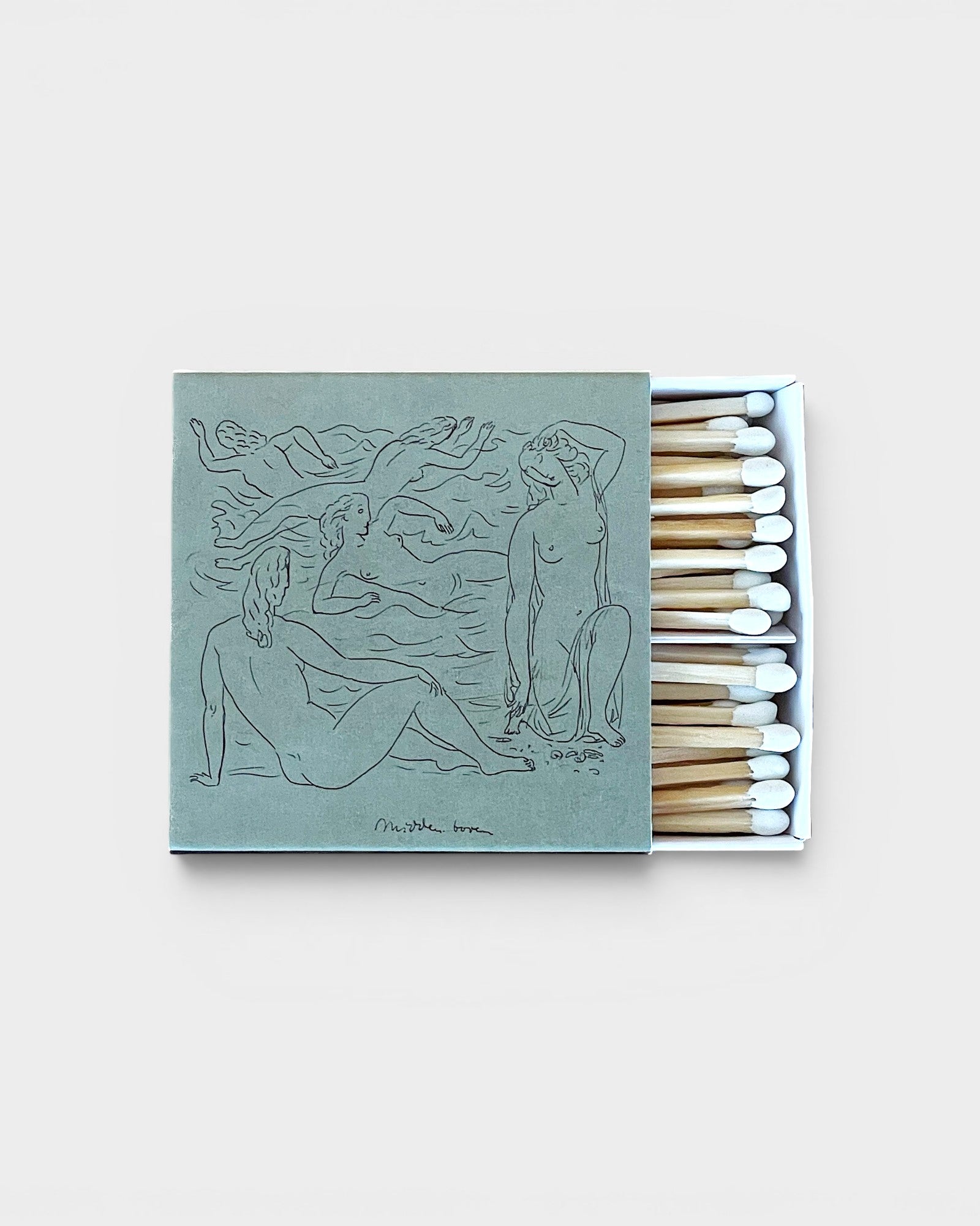JONES + CO Nue matchbox featuring a sage green cover with artistic line drawings of figures and white-tipped matches.