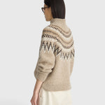 Model wearing a JONES + CO oatmeal mock neck sweater with a brown and cream fair isle knit pattern and ribbed trim.