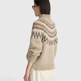 Model wearing a JONES + CO oatmeal mock neck sweater with a brown and cream fair isle knit pattern and ribbed trim.
