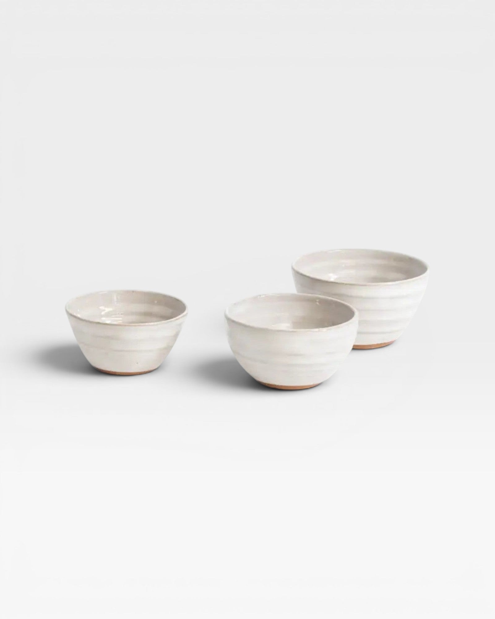 JONES + CO handcrafted off-white ceramic little bowls with a ribbed texture for kitchen or home decor.