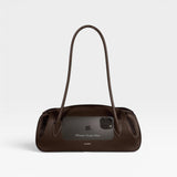 JONES + CO Oyster shoulder bag in espresso brown pebbled leather with a sleek, elongated silhouette.
