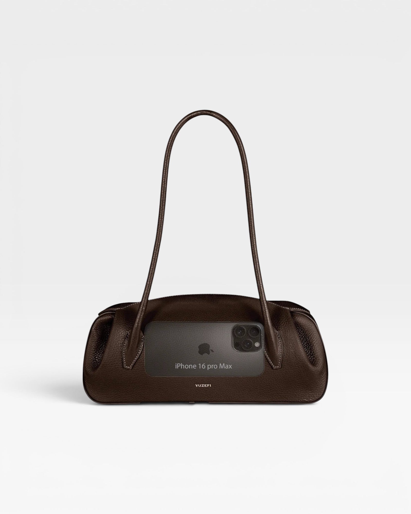 JONES + CO Oyster shoulder bag in espresso brown pebbled leather with a sleek, elongated silhouette.