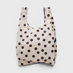 JONES + CO Standard Baggu reusable tote in cream nylon with a black polka dot pattern.