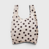 JONES + CO Standard Baggu reusable tote in cream nylon with a black polka dot pattern.