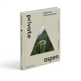 JONES + CO Private Aspen coffee table book featuring a triangular mountain home cutout on a beige hardcover.