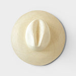 JONES + CO Ranchero Brisa natural straw hat with a wide brim and elegant hand-woven structure, top-down view.
