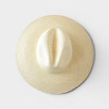 JONES + CO Ranchero Brisa natural straw hat with a wide brim and elegant hand-woven structure, top-down view.