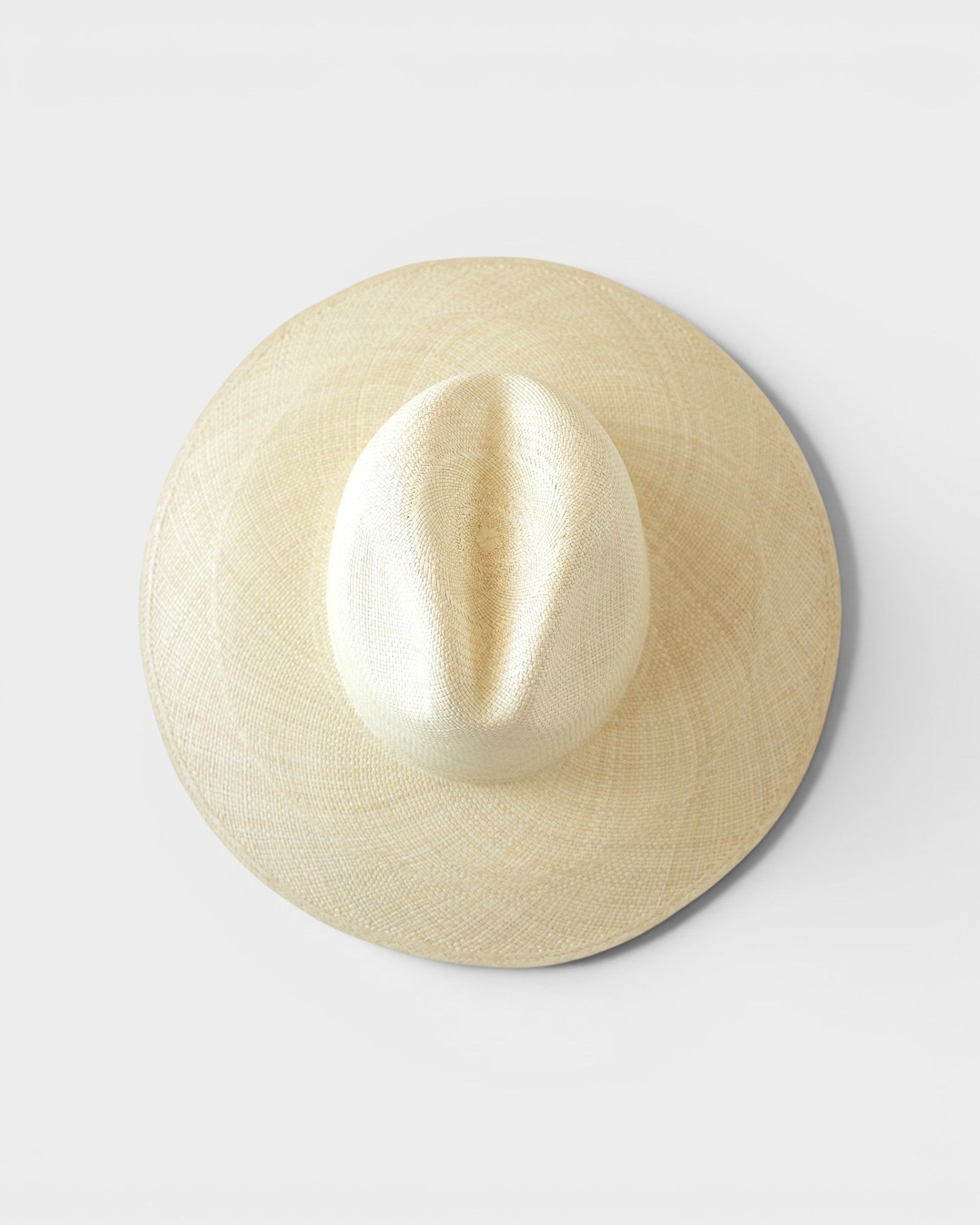 JONES + CO Ranchero Brisa natural straw hat with a wide brim and elegant hand-woven structure, top-down view.