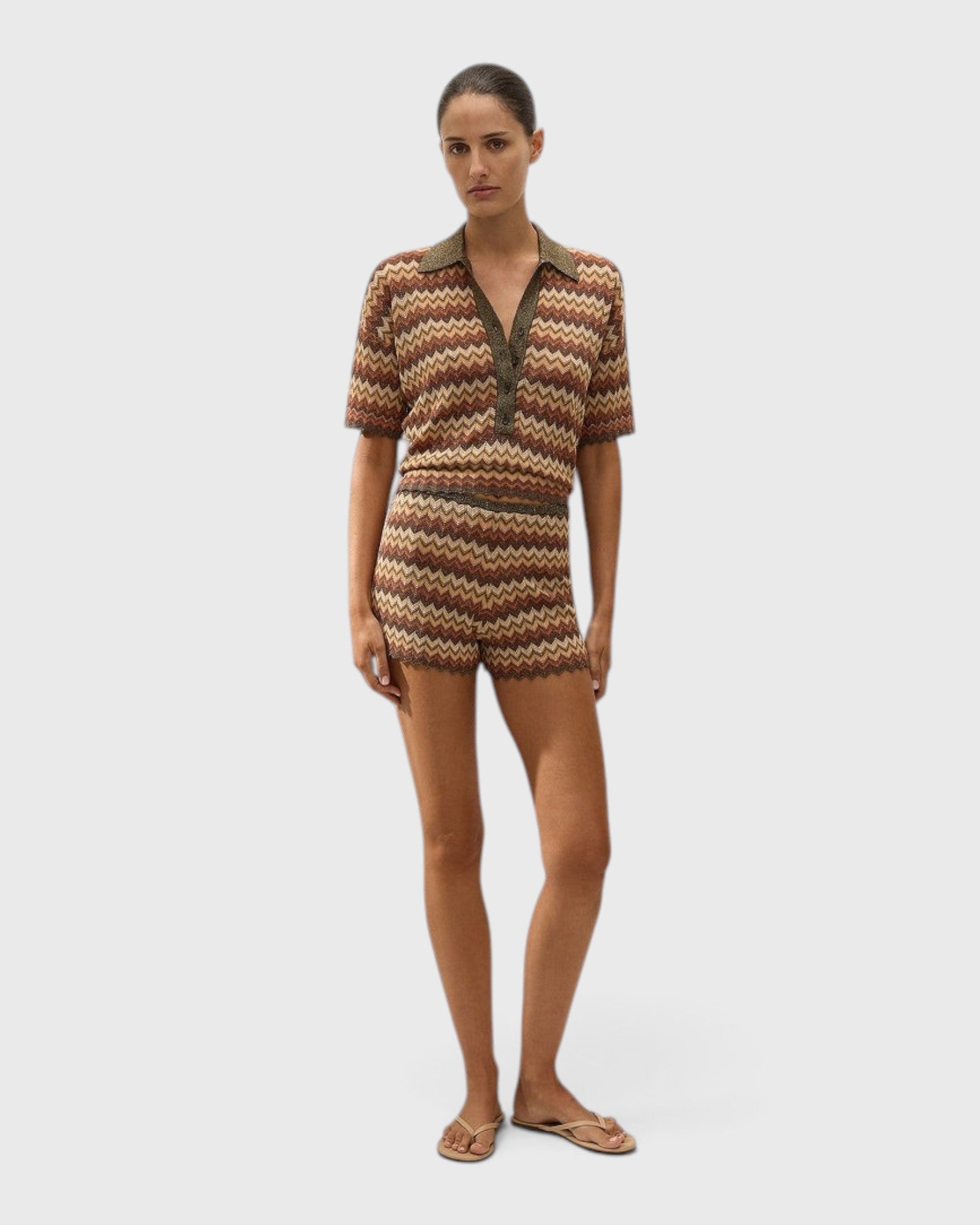 JONES + CO Raya high-rise knit mini shorts in a multi-color zig zag stripe pattern with a ribbed waistband.