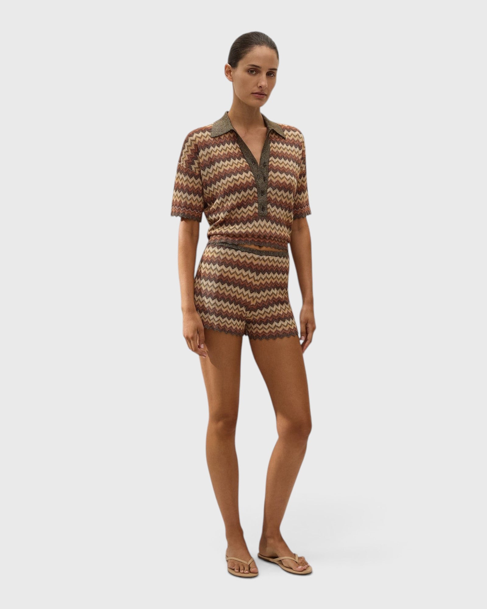 JONES + CO Raya high-rise knit mini shorts in a multi-color Lais stripe pattern with a ribbed waistband and zig zag hem