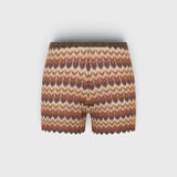 JONES + CO Raya high-rise knit mini shorts in a multi-color zig zag stripe pattern with a ribbed waistband.