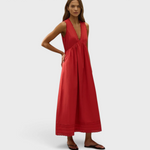 JONES + CO Jovita midi dress in red cotton poplin with V-neck, broderie lace trim, and pintucked hem on a model.