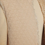 JONES + CO reversible short vest in oatmeal beige featuring a quilted wool blend side and soft faux fur texture.