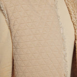 JONES + CO reversible short vest in oatmeal beige featuring a quilted wool blend side and soft faux fur texture.