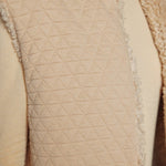 JONES + CO reversible short vest in oatmeal beige featuring a quilted wool blend side and soft faux fur texture.
