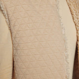JONES + CO reversible short vest in oatmeal beige featuring a quilted wool blend side and soft faux fur texture.